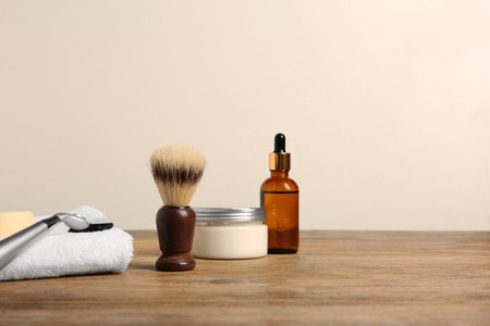 Set of men's shaving tools on wooden table, space for textの写真素材