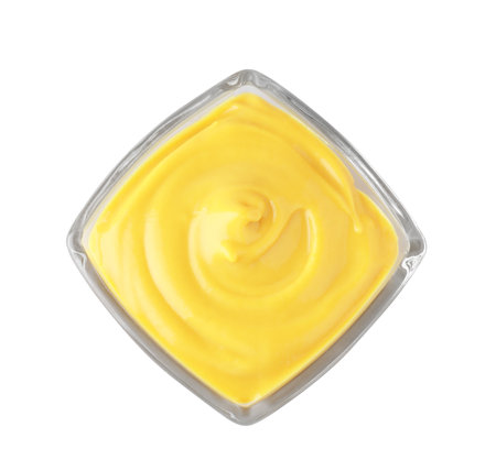 Bowl with delicious mustard on white background, top viewの写真素材