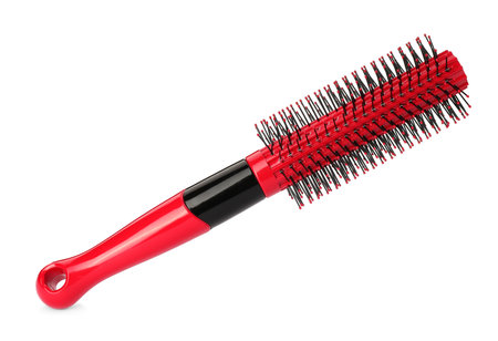 One new red hairbrush isolated on whiteの写真素材