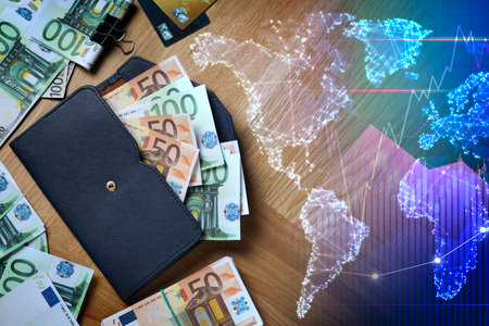 Foreign exchange market. Double exposure of digital world map, currency charts and moneyの写真素材