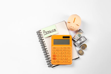 Calculator, card with the word Pension, piggy bank and money on white background, top view. Retirement conceptの写真素材