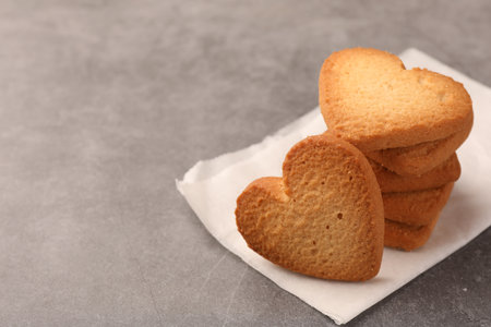 Heart shaped Danish butter cookies on gray table, closeup. Space for textの写真素材
