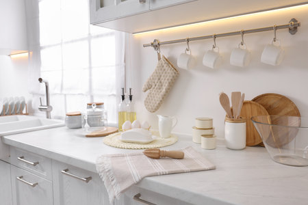 Set of different utensils and dishes on countertop in kitchenの写真素材