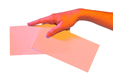 Man holding flyers on white background, closeup and space for text. Color tone effectの写真素材