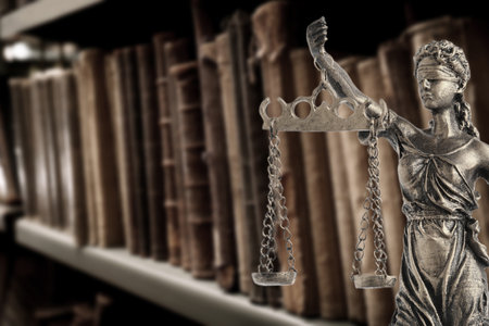 Law and wisdom. Statue of Lady Justice near shelves with books, space for textの写真素材