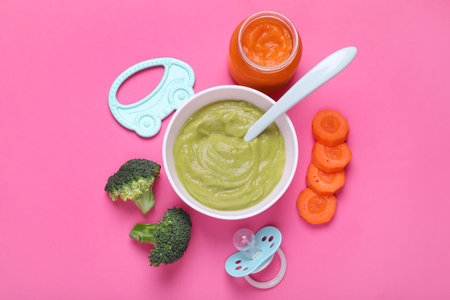 Flat lay composition with healthy baby food on pink backgroundの写真素材