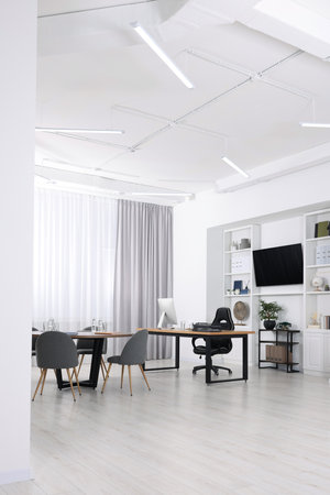 Stylish office with comfortable furniture and tv zone. Interior designの写真素材