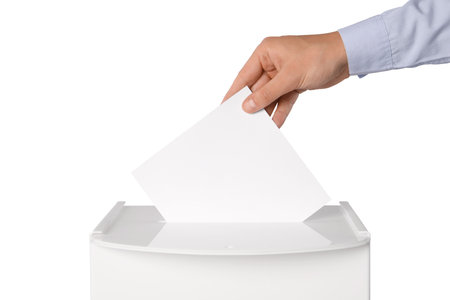 Man putting his vote into ballot box on white background, closeupの写真素材