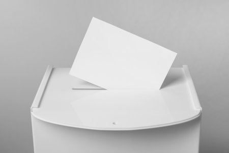 Ballot box with vote on light gray background, closeup. Election timeの写真素材