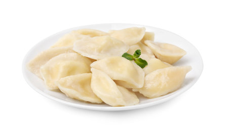 Plate of delicious dumplings (varenyky) with cottage cheese isolated on whiteの写真素材