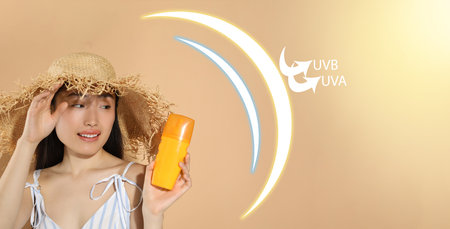 Sun protection product as barrier against UVA and UVB, banner design. Beautiful young woman with...