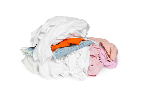 Pile of colorful clothes isolated on whiteの写真素材