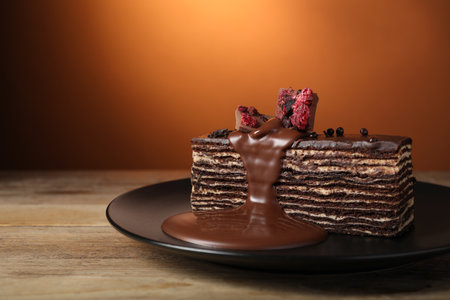 Tasty chocolate cake on wooden table, space for textの写真素材