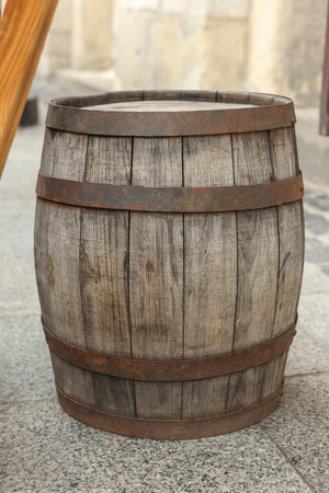 Traditional wooden barrel on street outdoors. Wine making