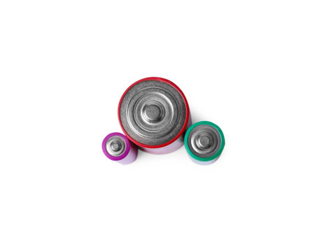 Three different new batteries isolated on white, top view