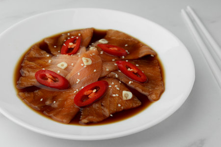 Tasty sashimi and chopsticks on white marble table, closeupの写真素材
