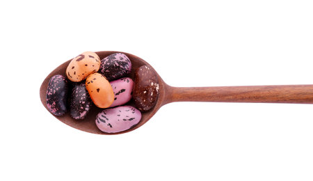 Wooden spoon with dry kidney beans isolated on white, top viewの写真素材