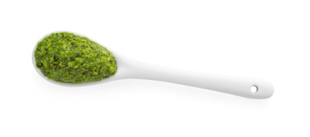 Spoon with delicious pesto sauce isolated on white, top viewの写真素材