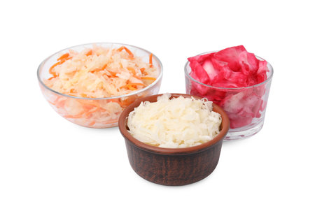 Delicious sauerkraut prepared according to different recipes on white backgroundの写真素材