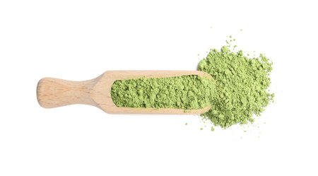 Scoop with matcha powder isolated on white, top view
