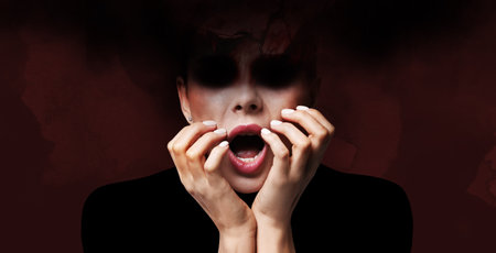 Hallucinations. Scared woman on maroon background. Dark essence flowing out from her black hollow eyesの写真素材