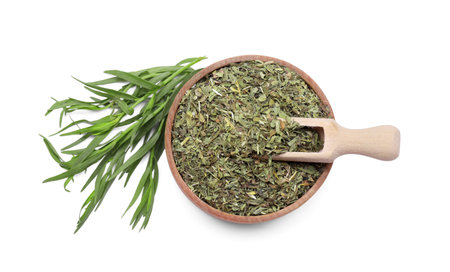 Bowl of dry tarragon, scoop and fresh leaves isolated on white, top viewの写真素材
