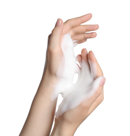 Woman with cleansing foam on white background, closeupの写真素材