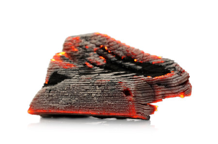 Piece of smoldering coal on white backgroundの写真素材