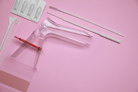 Sterile gynecological examination kit and medications on pink background, flat lay. Space for textの写真素材