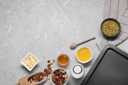 Ingredients for making delicious baklava on gray textured table, flat lay. Space for textの写真素材