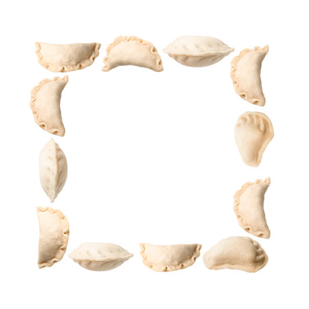 Frame of raw dumplings (varenyky) on white backgroundの写真素材