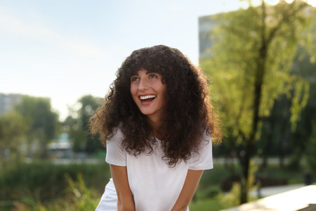 Portrait of beautiful woman in glasses outdoors. Attractive lady smiling and posing for cameraの写真素材