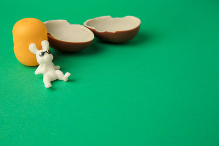 Slynchev Bryag, Bulgaria - May 25, 2023: Halves of Kinder Surprise Egg, plastic capsule and toy...