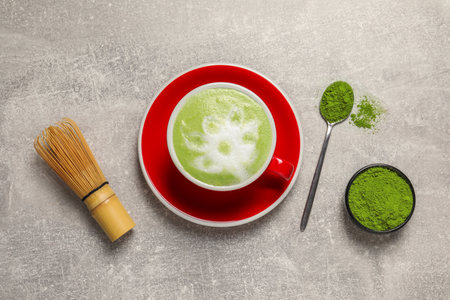 Flat lay composition with tasty matcha latte on light gray tableの写真素材