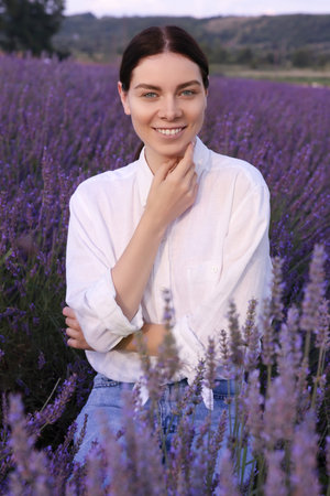 Portrait of smiling woman in lavender fieldの写真素材