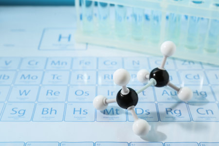 Molecular model and test tubes on periodic tableの写真素材