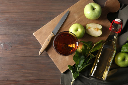 Flat lay composition with delicious apple cider on wooden tableの写真素材