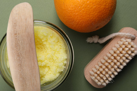 Flat lay composition with natural body scrub on olive background. Anti cellulite treatmentの写真素材