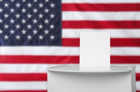 Ballot box with vote against national flag of United States, space for textの写真素材