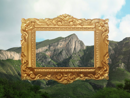 Vintage frame and beautiful mountains under blue sky with cloudsの写真素材