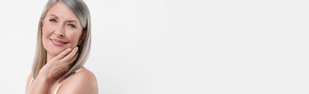 Portrait of beautiful mature woman on white background. Banner design with space for text
