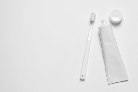 Plastic toothbrush and paste on white background, top view. Space for textの写真素材