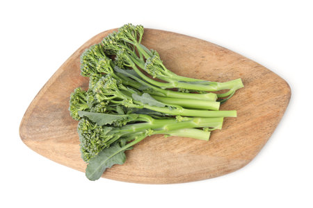 Wooden board with fresh raw broccolini isolated on white, top view. Healthy foodの写真素材