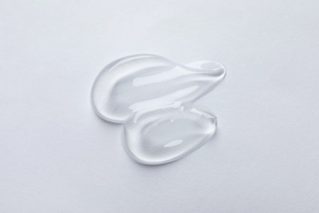 Swatches of cosmetic gel on white background, top viewの写真素材