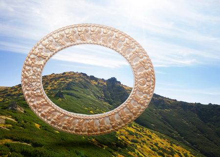 Vintage frame and beautiful mountains under blue sky with clouds