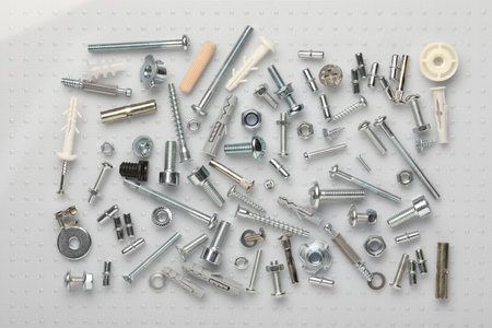 Many different fasteners on plastic surface, flat layの写真素材