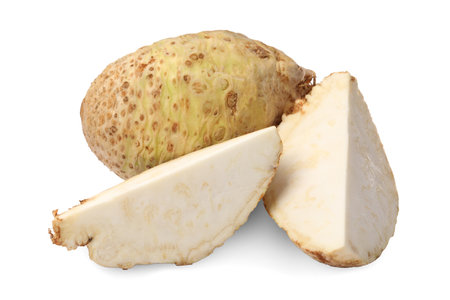 Whole and cut celery roots isolated on white