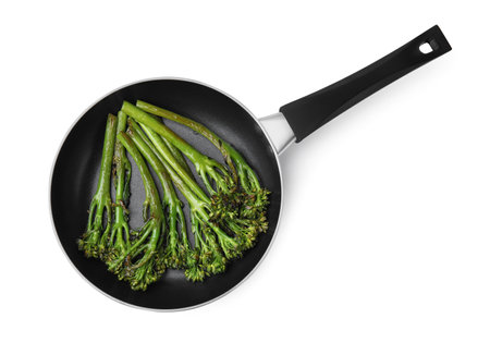 Frying pan with tasty cooked broccolini isolated on white, top viewの写真素材