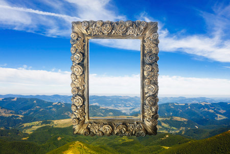Vintage frame and beautiful mountains under blue sky with cloudsの写真素材