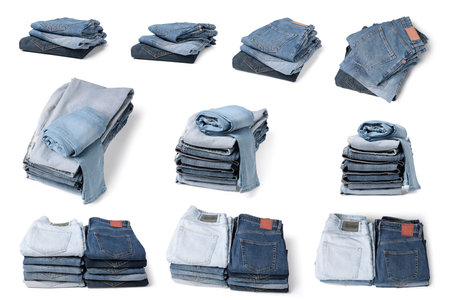 Set with folded different jeans on white backgroundの写真素材